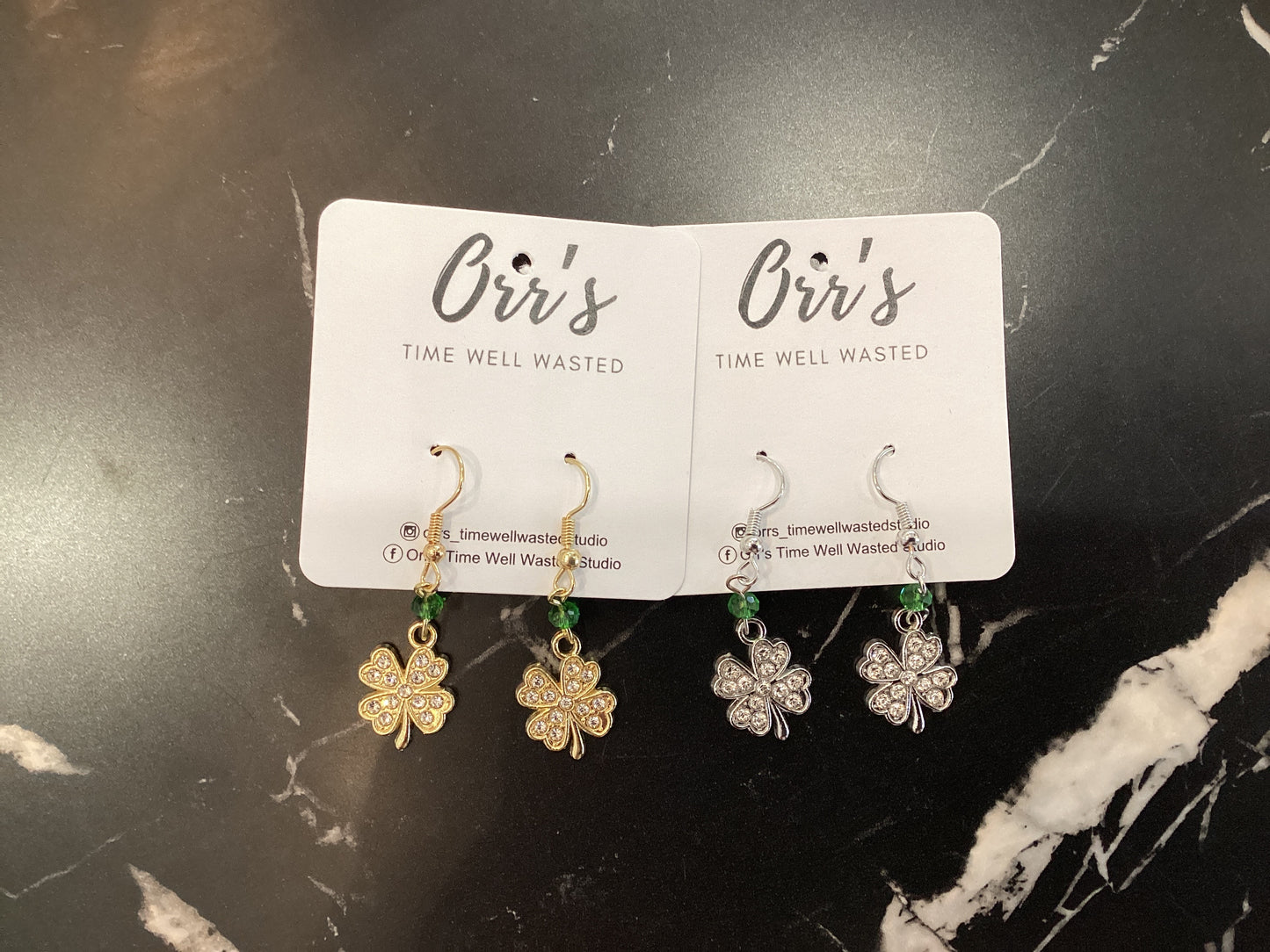 Orr’s Time Well Wasted four leaf clover earrings